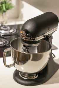 black and silver kitchenaid stand mixer on top of white surface