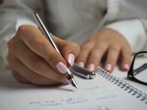 person hands woman pen